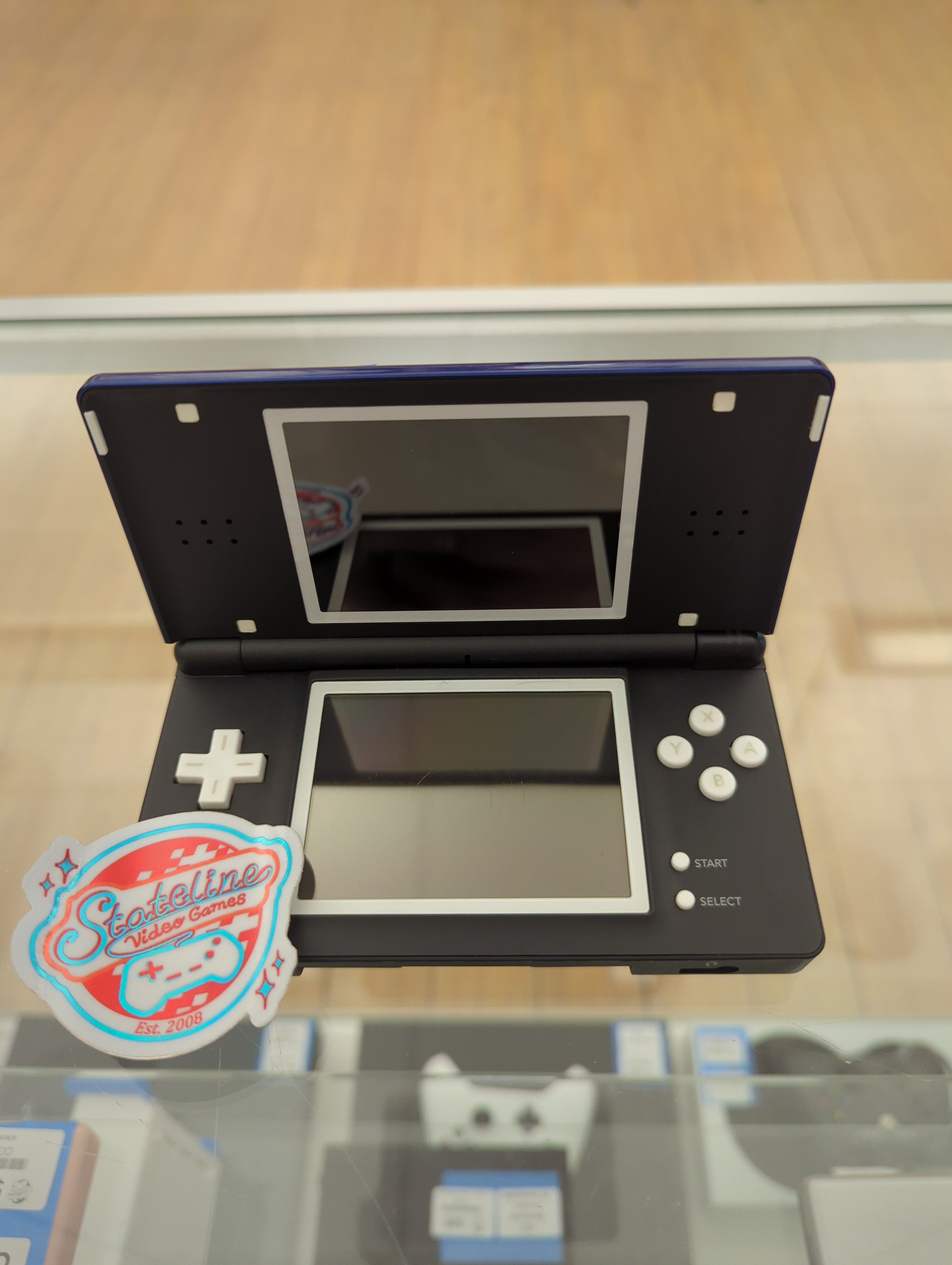 Nintendo store DS Lite system with games and charger